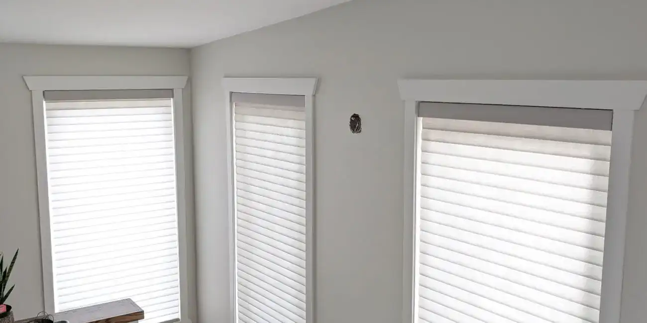 Elegant Sonnette® roller shades providing privacy and light control for contemporary interiors. Perfect for enhancing home decor with sleek, functional window coverings.