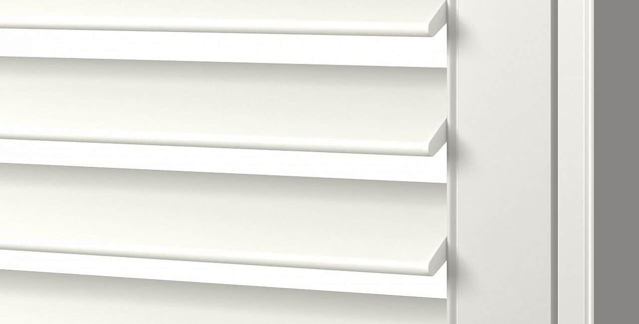 Close-up of white horizontal slatted window blinds, showing clean, modern design and adjustable louvers for light control and privacy.