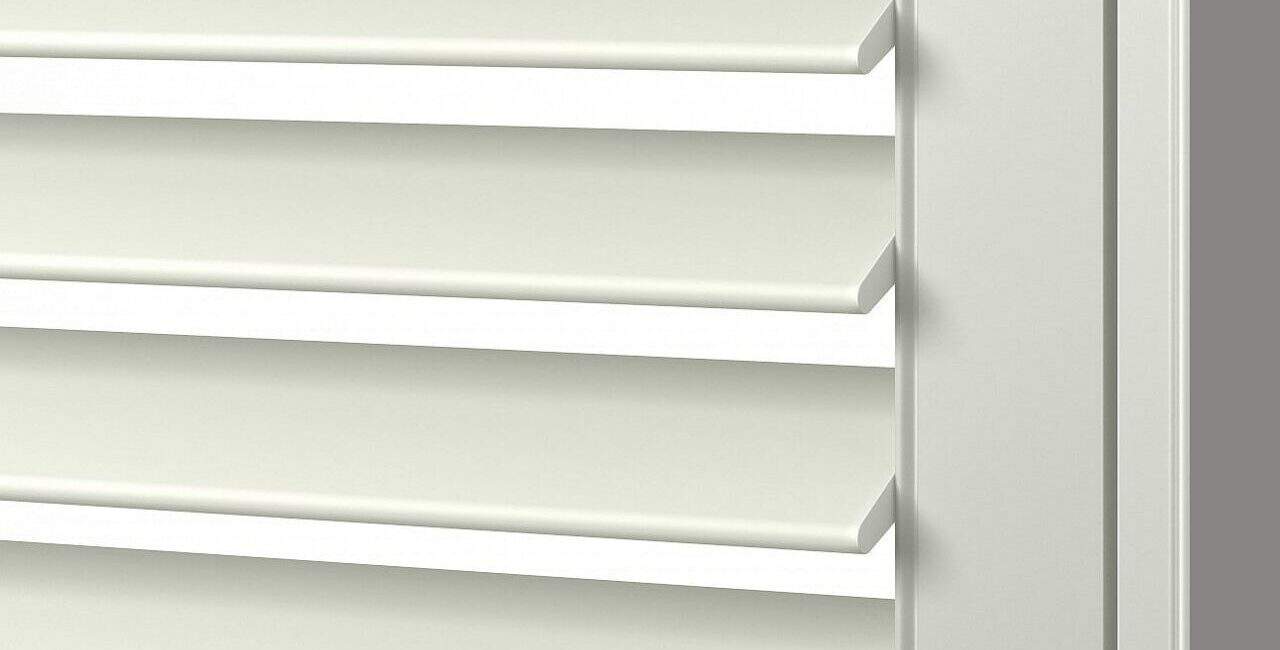 Elegant white vinyl shutters with adjustable louvers for light control.