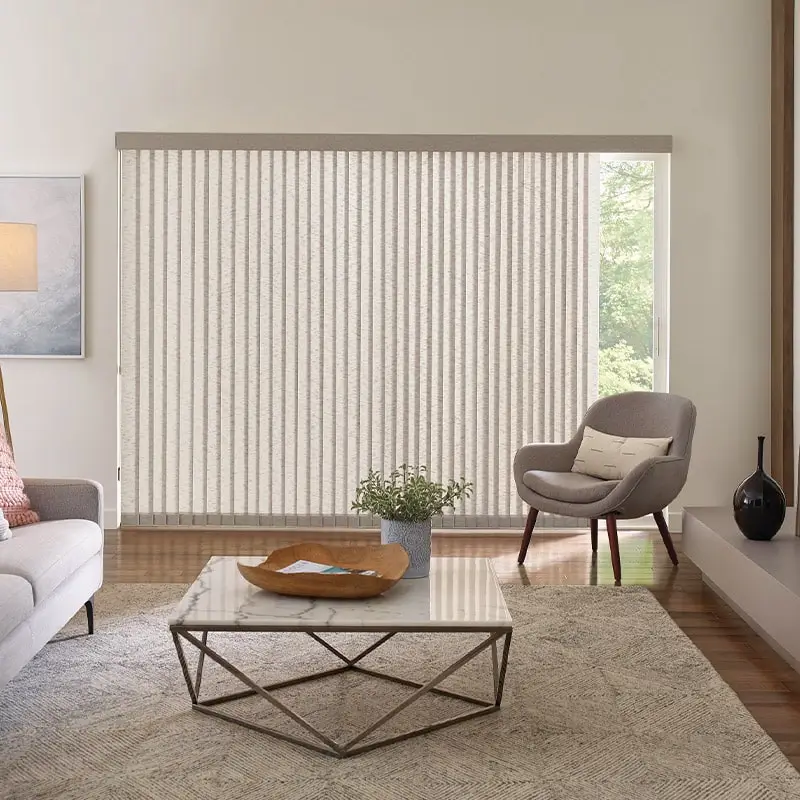 Bright and airy living room with vertical blinds, contemporary furniture, and neutral decor, creating a stylish and functional space for relaxation and natural light.