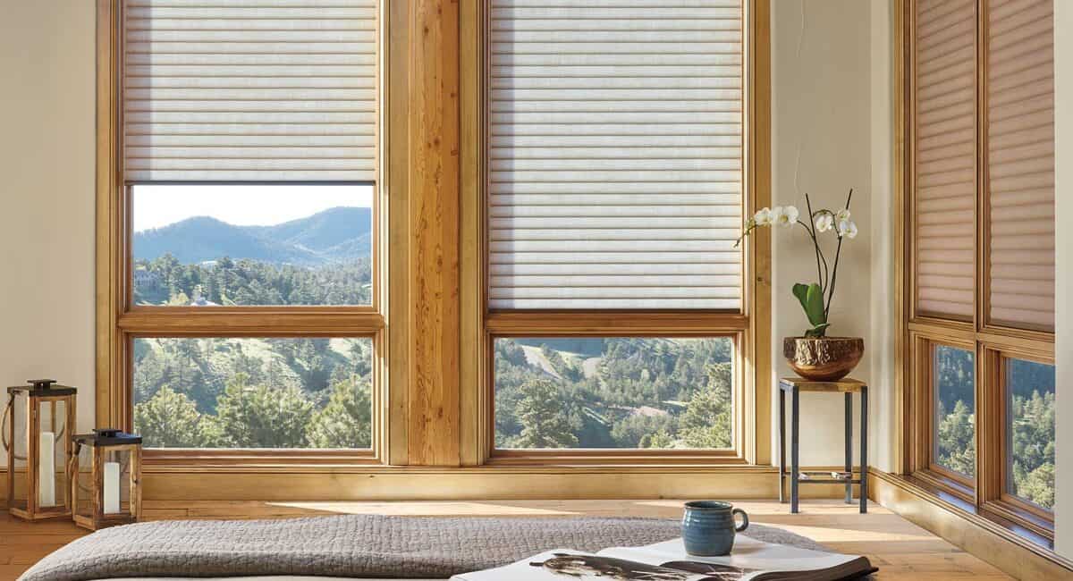 Bright room with wooden window frames, scenic mountain landscape outside, modern interior decor, relaxing atmosphere, natural sunlight, cozy and peaceful setting, home with nature views, indoor plants, stylish home design, scenic escape.