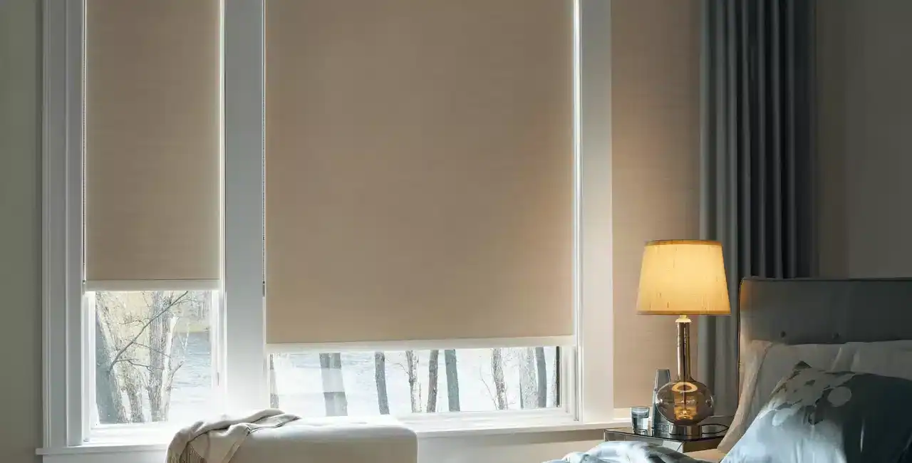 Elegant bedroom with beige window blinds, soft lighting, and contemporary decor.