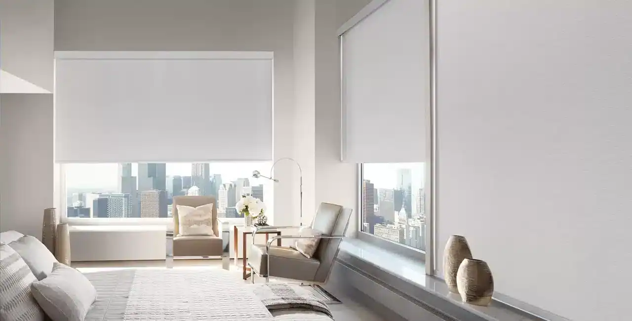 Bright, airy bedroom with large windows showcasing a city skyline, minimalist decor, neutral tones, and sleek furniture. Perfect for urban living and capturing cityscape views.