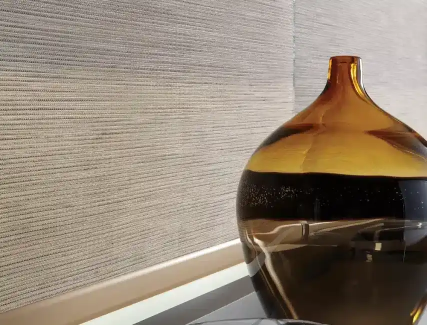 Stylish glass vase with warm amber and dark tones paired with a sleek black bowl for home decor.