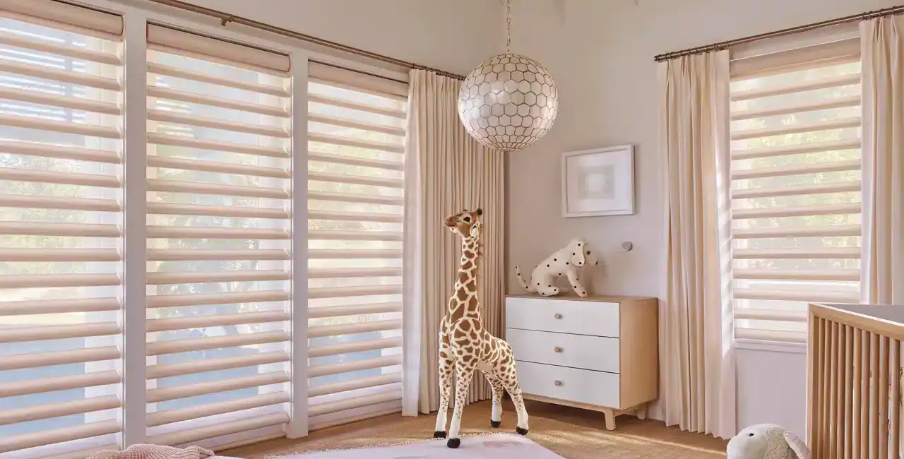 Bright nursery with plush toys, stuffed giraffe, dog, and rabbit in a cozy, sunlit room with modern window shades and calming decor.