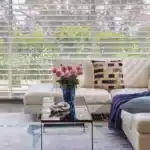 Bright, contemporary decor with natural sunlight, stylish accents, and fresh plantings create inviting and relaxing home atmosphere.
