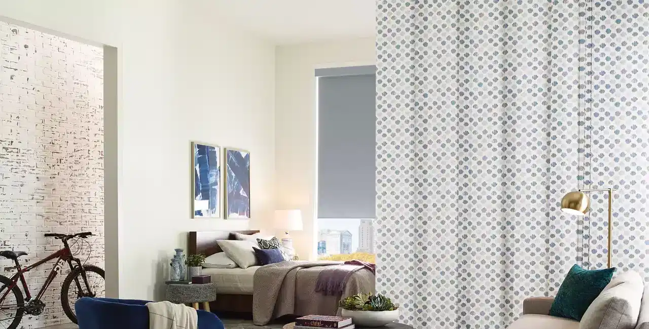 Bright and stylish living room with cozy seating, contemporary decor, and a decorative partition wall for a chic home design.