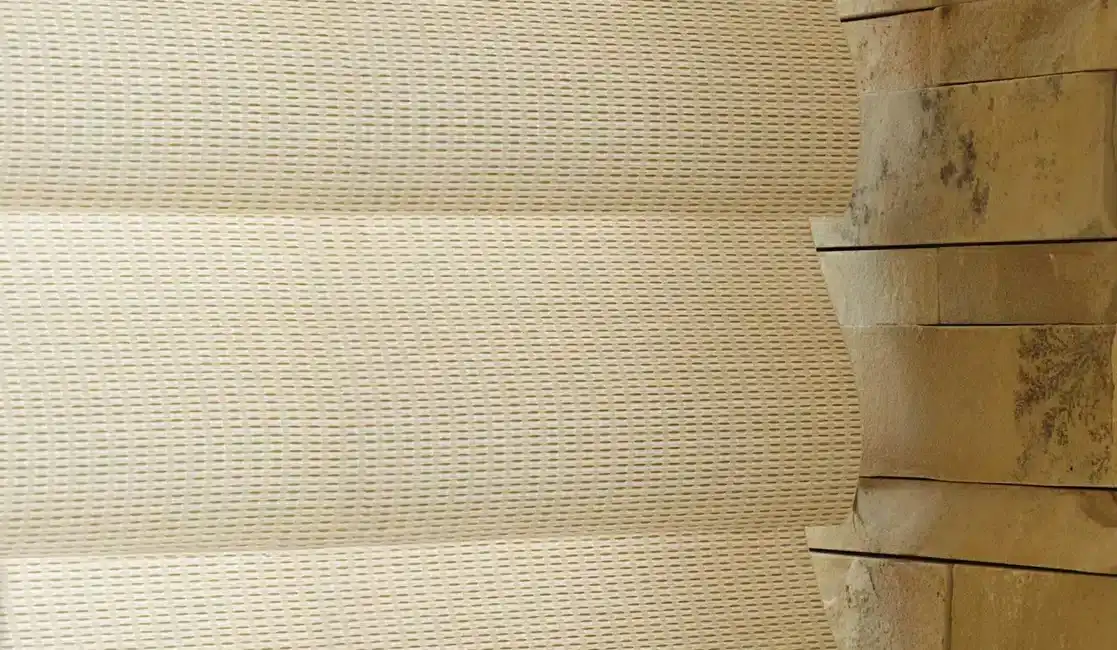Elegant neutral curtains with a woven pattern fitting a cozy, natural interior design.