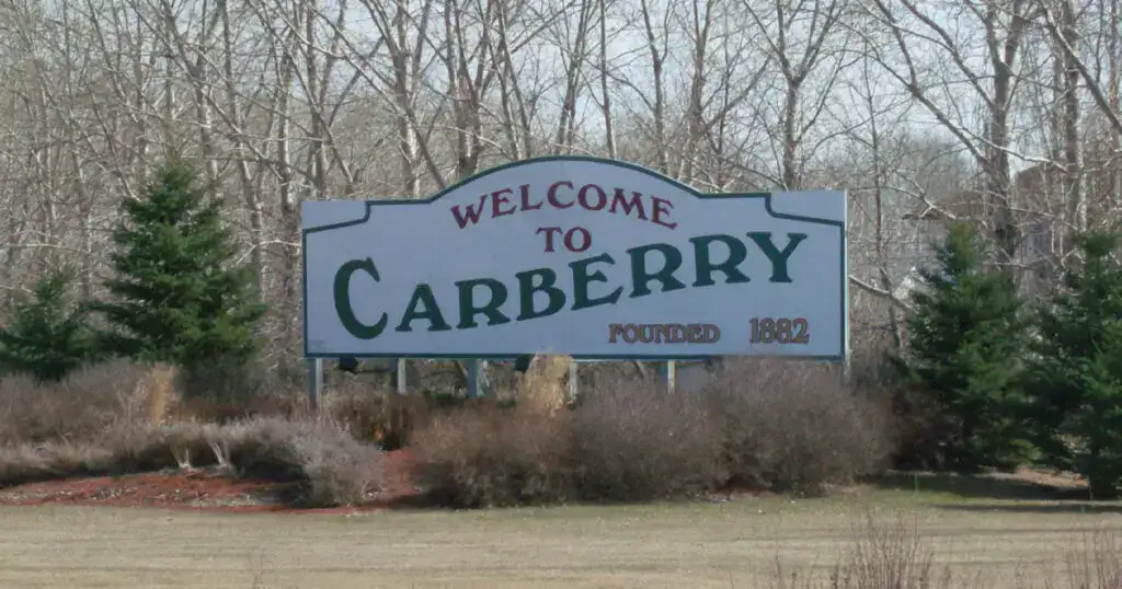 Welcome to Carberry, Manitoba, established in 1882, featuring a scenic rural setting with trees and open space.