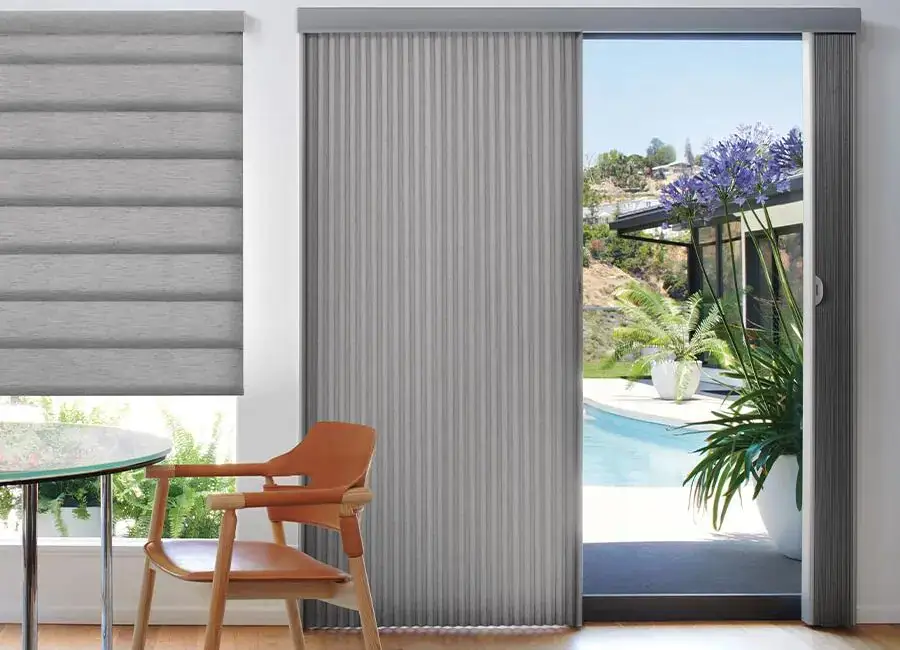 Modern interior with Vertiglide™ sliding door, showcasing sleek design, smooth operation, and seamless transition to outdoor patio and garden.